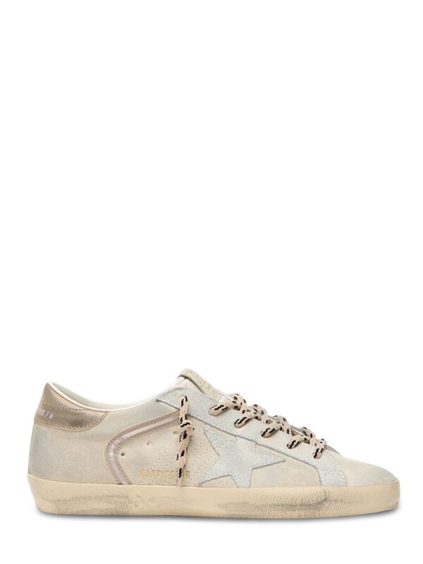 distressed off-white low-top sneakers with signature star detail