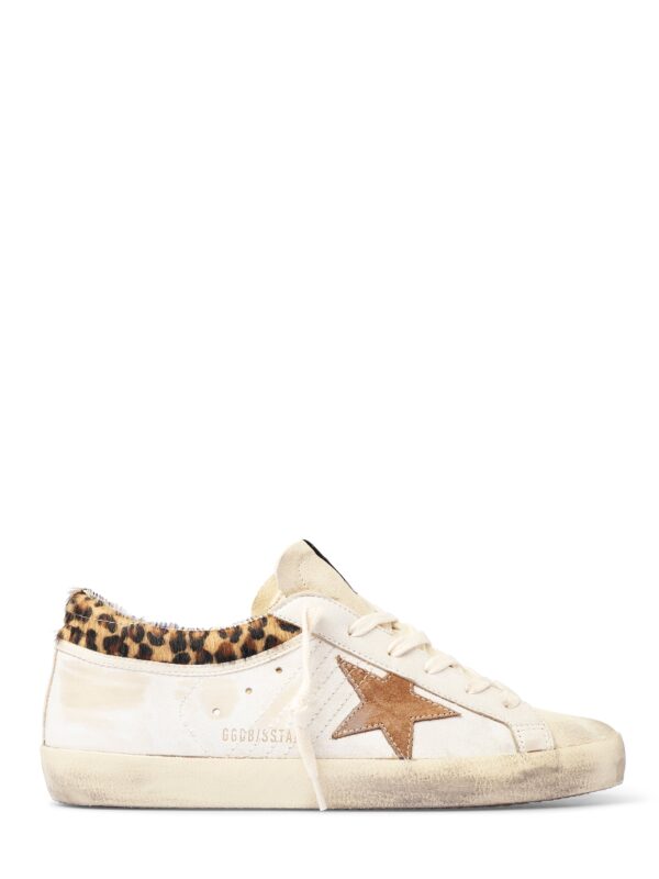 distressed white low-top sneakers with leopard print collar