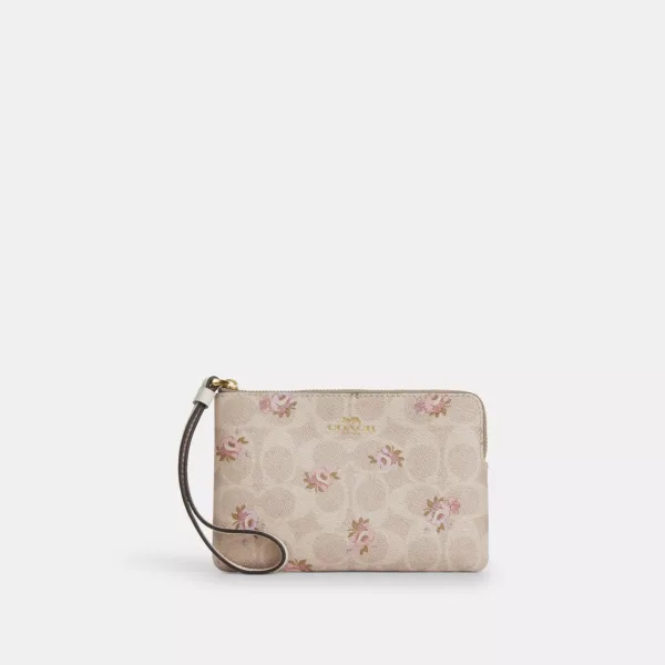 corner zip wristlet in signature canvas with floral print